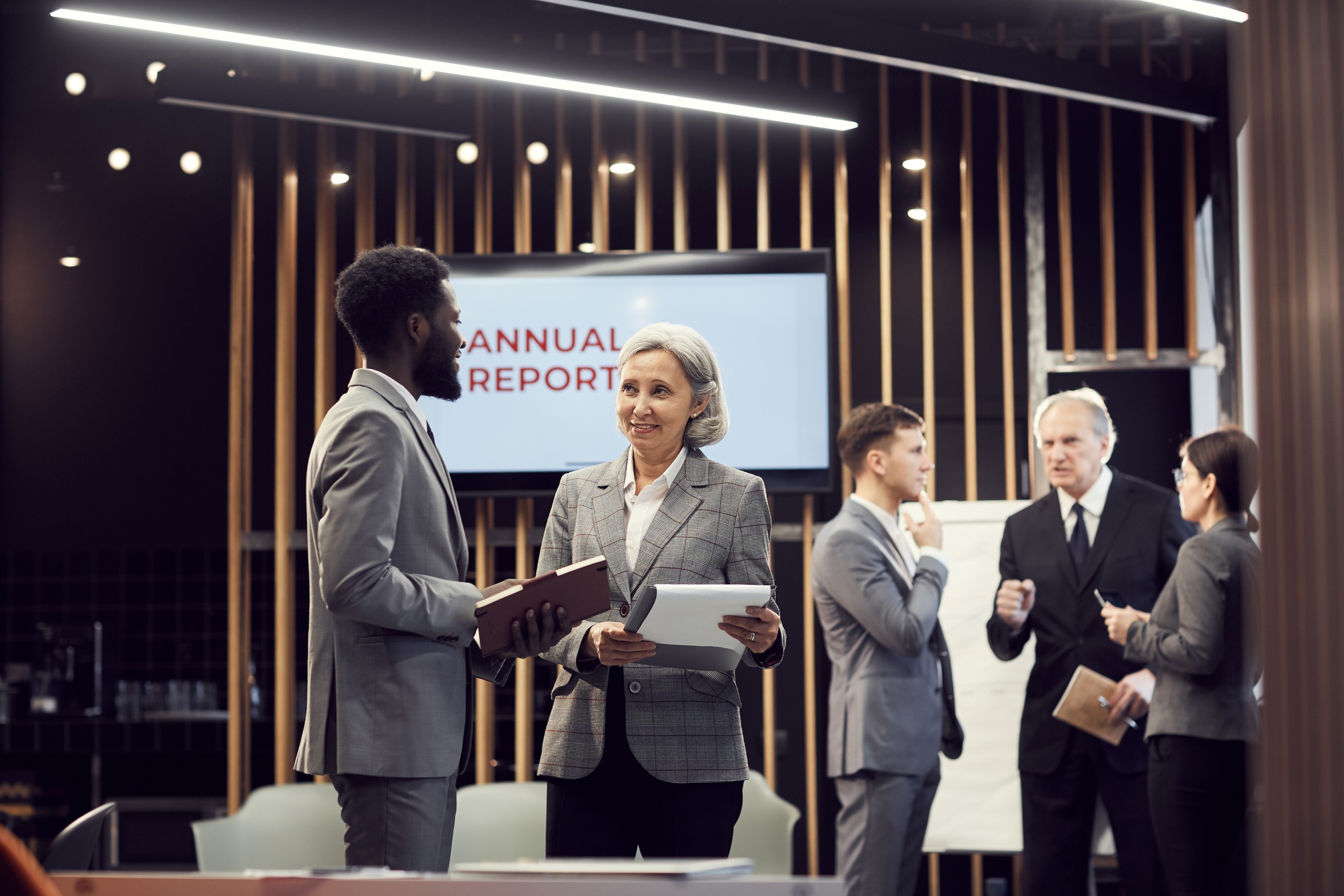 Analyzing annual report at business meeting